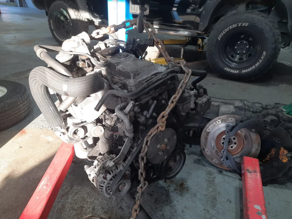 Mitsubishi diesel engine pistons and connecting rods removed for inspection