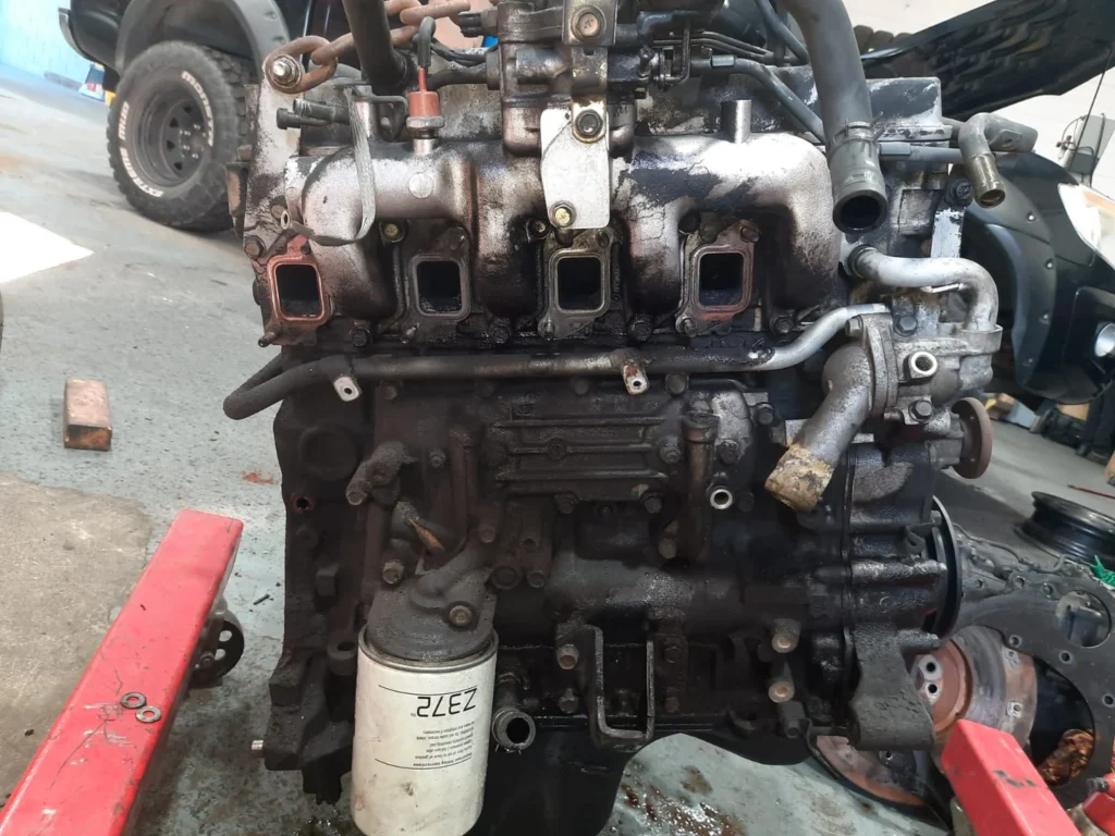 Mitsubishi diesel engine undergoing diagnostic testing after rebuild