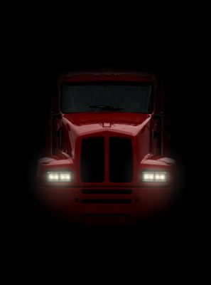 Eighteen wheeler coming head-on out of darkness